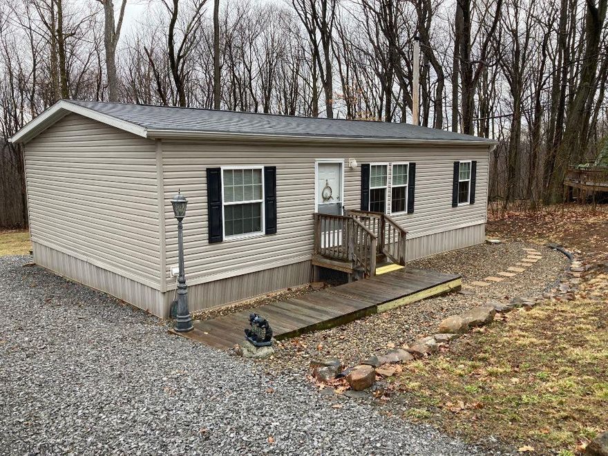 Turn key home ready for you! 24x40 2012 Fleetwood doublewide on 2+ private acres. Home is like new. Appliances included. 2 large outbuildings 8x12 and 12x20 included. Central air, electric heat, 220 amp electric, inviting rear deck with retractable awning. Close to Blue Knob State Park and Blue Knob Ski Resort.