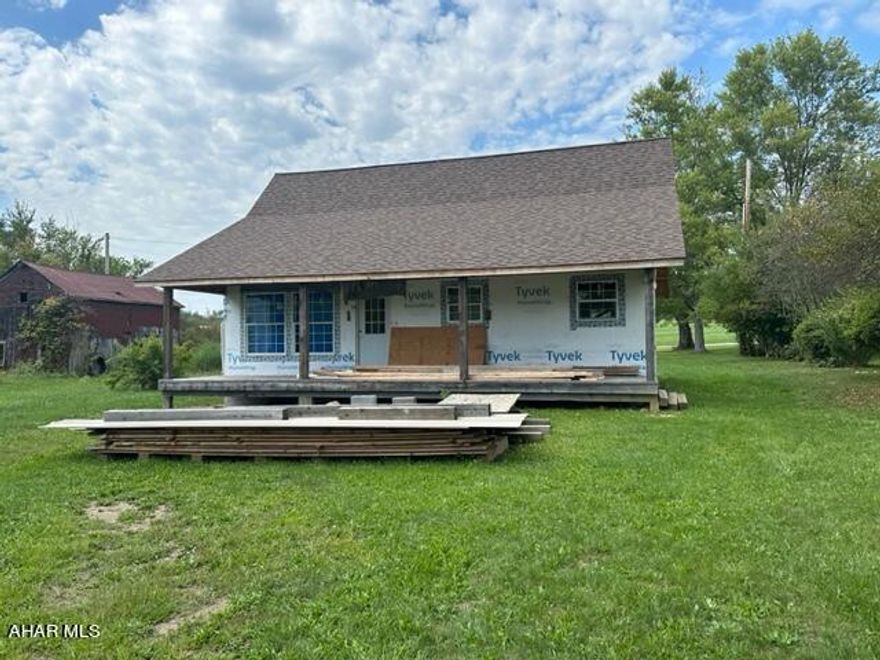 A perfect opportunity to finish a house just the way you've always wanted.   Originally designed as a 2 bed 1.5 bath home but possibilities are endless at this point.  Under roof, shingled, windows, some wiring complete.  Sewer tap paid, deeded well access.  All but adjoining Shawnee State park this would make a wonderful location for full time or weekend living.   Give us a call today.