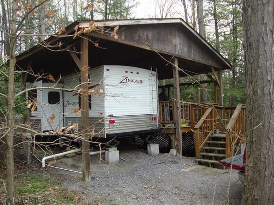 Escape to this mobile RV under a spacious custom-made pavilion with huge deck under roof.  This heated and air conditioned camper sleeps 10.  All of the amenities of Glendale Yearround gated community are at your disposal - community swimming pool, tennis courts, planned activities.  The unit has a lot of built in storage.  Just minutes from Prince Gallitzin Park, this property is in walking distance of the "catch and release" fishing pond.  This is a great getaway which you can use all year long.  And it is only a few years old!  Don't miss this one.  Showings must follow CDC and DOH Guidelines. Any COVID-HSA form with “yes” answers need to be submitted and acknowledged by sellers.