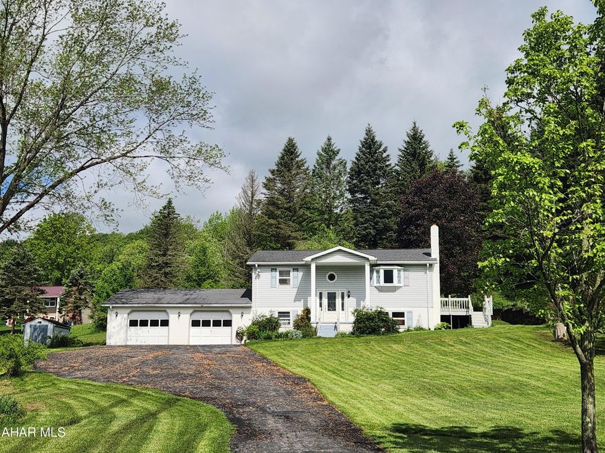 Sitting on  1.67 acres is this three bedroom two bathroom home in Bellwood School District.  This split level home offers open entertaining with a light and cheery sunroom off the kitchen.  The lower level was remodeled and leads to the attached garage. The exterior of the home offers so much! Pond, deck, shed, alot of yard space, and basketball court are just a few amenities this home offers. Make this house your new home. Call listing agent for more information or your private tour.