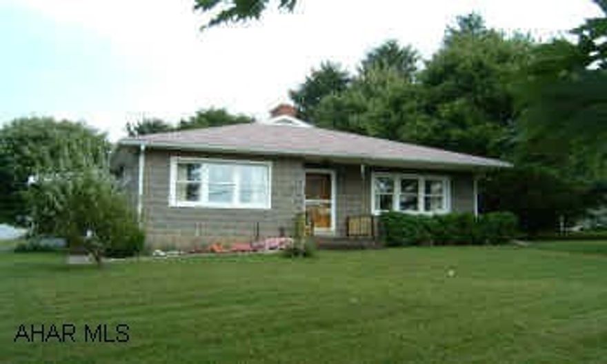 Great location, out of town on 1 acre, but close to stores and schools. New central air, replacement windows, 8 yr. roof.  All appliances included. 1 car garage and workshop area in basement.  Maintenance free exterior. 2 story horse barn.  Great location. Out of town on 1 acre but close to stores and schools.  Spacious yard with fireplace for cookouts.  New central air, replacement windows, large closets, large porch.  Laundry on 1st floor.  Extra bedrooms could be added in basement.