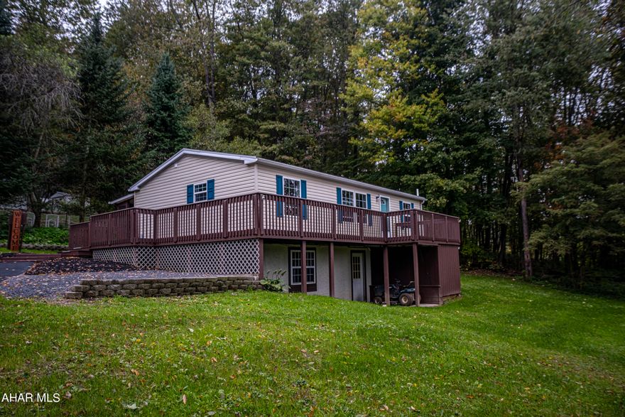 Totally updated doublewide on a full foundation. This home features 3 large bedrooms with a master suite and master bath. A gorgeous open concept  eat in kitchen with granite counter tops . . A spacious family room and first floor laundry make this perfect. A large wrap around deck for entertaining with a screened in back patio and a walk out basement. Call and schedule a tour.