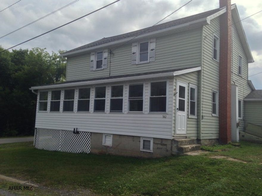 This is a home with a lot of space, on a corner lot, and just over 15 minutes to Raystown. There is a large bonus room downstairs that could be used as a fourth bedroom or as an office. The living room is wired for surround sound, and connects to a recently updated sunroom. Additionally, the furnace is set up for wood, coal, or oil, and the home is only a short distance away from the elementary school.