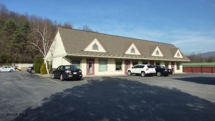Newer commercial building in Hollidaysburg.  Four unit office space with 4200 sq. ft. of warehouse space.  All four office spaces are currently occupied.  Total finished office space 3330 sq.ft.  Rear warehouse space with 3 garage doors.Leases in place.