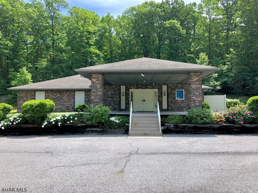 Well cared for brick building with paved parking lot, carport/drop off area at front doors, lobby, coat room, reception counter, auditorium, stage, wired for audio/visual, conference room/library, kitchen, public restrooms, nursing room, & utility room. Situated on a beautiful 1.65 acre lot in a lovely setting. Just 13 miles to Lake Raystown Resort and 22 miles to Seven Points Marina. Being sold AS IS. Additional addenda for all offers.