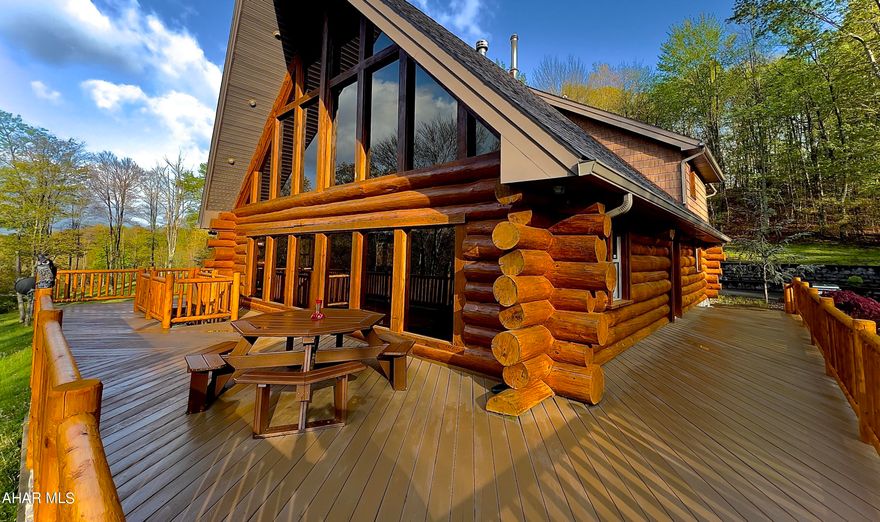 This property features over 55 acres of secluded wooded and cleared level land in Hollidaysburg school district just 4.5 miles from the Borough. Truly one of a kind property offering amazing valley views with a Luxury four bedroom A-Frame dwelling home with wrap-around sun deck and a detached fully insulated 3600 square foot commercial building on the property with three phase electric and 12 ft overhead doors.  The A-Frame home is positioned at the northernmost point of the property  just below its hilltop boasting 43 acres of wooded land. The home features two full baths, multiple heat sources including a wood burning fireplace and woodstove in the family room. The windows have been treated to reflect the sun's UV, glare and heat.  Additionally the home features recessed lighting inside and out with strategic landscaping, outdoor recreation area, firepit, playground and two car attached garage. The Primary Bedroom Suite brings plenty of natural light, and has its own walk-in closet and balcony overlooking the home's paved driveway and includes a primary en suite bathroom featuring dual vanity sinks, a walk-in waterfall shower.  The kitchen was remodeled in 2021 and features custom wood and stone cabinetry, garbage disposal, stainless appliances with access to the home's garage and dining room.  The walk-out lower level provides nearly 1,500 sq/ft of finished space including its own bathroom, laundry facilities, and wood burning stove with a stone chase that extends up through the entire home. The three phase insulated climate controlled commercial building sits towards the entrance of the property offering plenty of workspace and provides its own designated business mailing address with separate utilities from the home. Two of the five garage bay doors are 12x12 making it accessible for big projects and RV storage. The home also features open concept living, central air, first floor guest bedroom and bath, granite kitchen countertops, vaulted ceilings, a 2-Story Great Room. $270,000.00 TOTAL Seller Renovations and Updates since purchased.

- $20K Seller prior to listing updated the home with all New Railings, New Deck Boards where needed, sand restain deck.
- $120K Renovations and Additions, Dormers front and back and New Roofing, Primary Bedroom, Primary Bath, Primary Closet.
- $100K Renovations and Additions, Updated and Doubled the size of Kitchen, adding granite island, added ceiling fans, cleared the perimeter of the dwelling and added recreation area.
- $5K Seller added water softener system
- $25K Seller added a heat pump and central AC system.