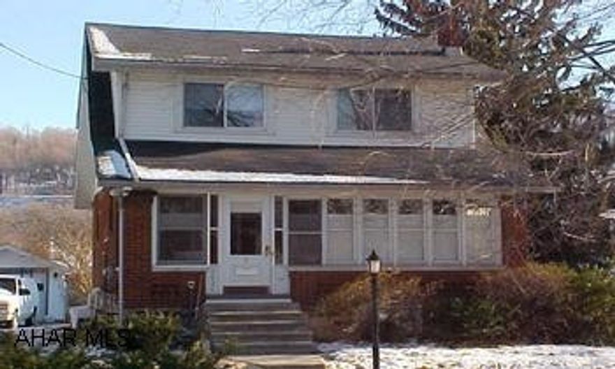 Dutch Colonial Brick/Vinyl- Quiet Residential Neighborhood. Light & Bright-  Great location!  Close to everything!  Updated electric, newer furnace, roof , windows- fenced yard.  Doggie Door Detached Garage.  Gas fireplace in LR.  Cobblestone patio- new lighting in kitchen and new flooring.