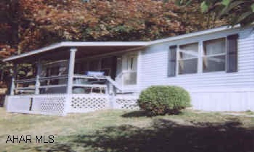 1995 CHAMPION DOUBLEWIDE OWNER ANXIOUS - BELOW MARKET.  PRETTY TREED LOT.