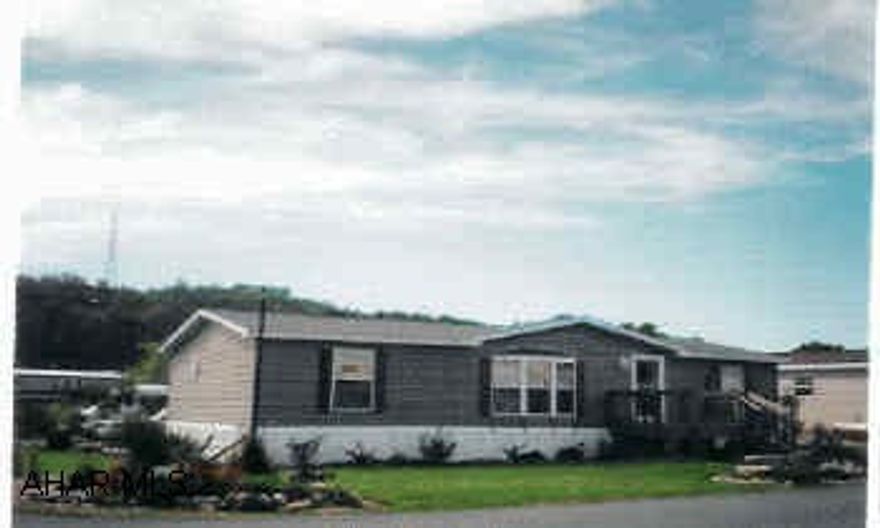 2002 Marlette Doublewide in excellent condition. Covered deck and flower gardens. 6 parking spaces, located on rented lot $200 per month includes trash. Front Deck 8x12, Rear covered deck 16x20, 12x20 Eshes barn