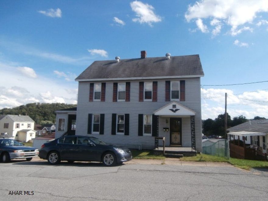 Vinyl sided two story with detached two car garage. REO property. Needs some interior fix up. Sold as is.