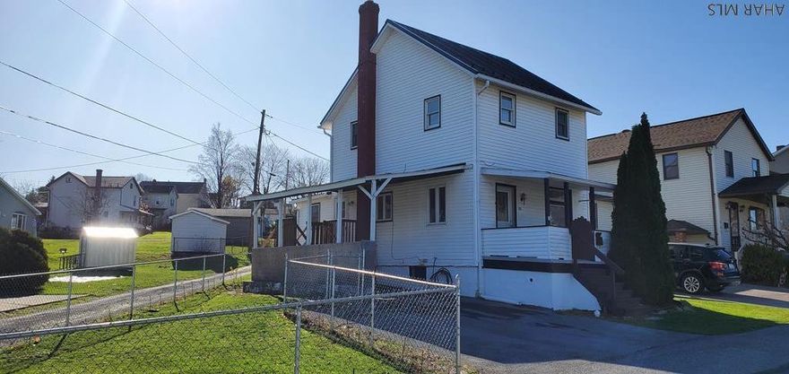 Nicely renovated 2 story home with 3 bedrooms, 1.5 baths and convenient 1st floor laundry.  New furnace with central air and new hot water tank.  Updated kitchen with appliances included.  Metal roof, fenced yard, corner lot.  Carport and covered front porch!  Priced for immediate sale.