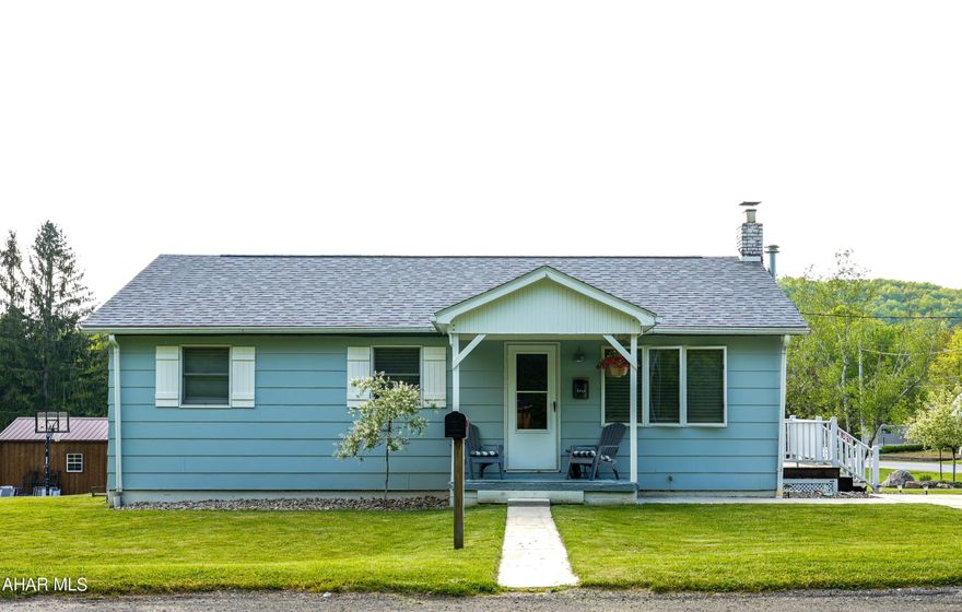 This well-maintained home has easy one floor living and is close to recreation. The wrap-around deck offers a view of a large manicured yard which is 140x100 ft.  Many updates to this home include a new roof, concrete driveway, sidewalk, water line, french drains,  deck with vinyl fencing, floors, bathroom, stove and hot water tank. Enjoy two sources of heat; oil and hard coal with a newer oil furnace and chimney. This cute and attractive  home portrays a nautical feel as soon as you enter the front porch. Come and check it out!