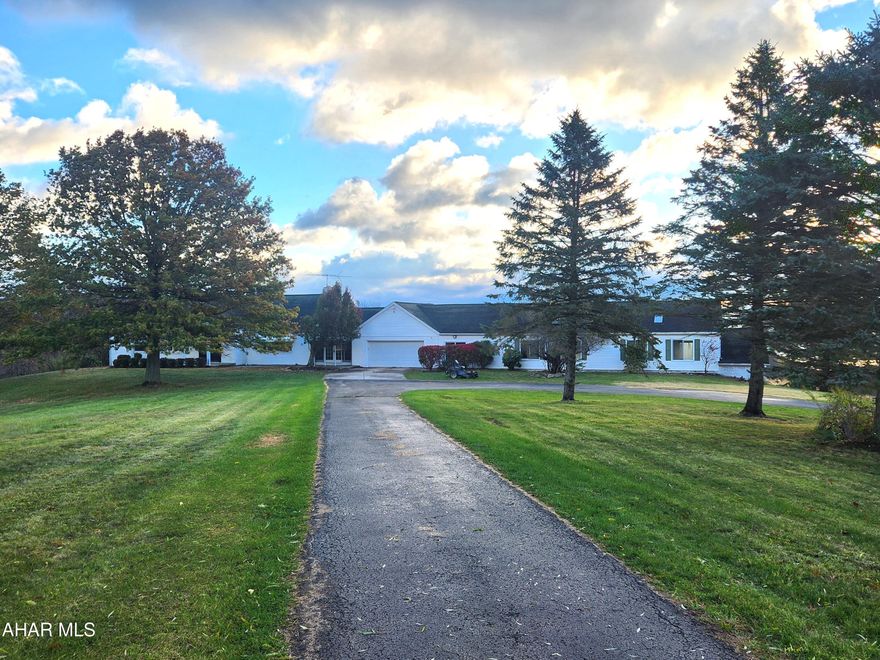 For comparable sale purposes only.  Brick home with 2,586sf, partially finished basement, indoor in ground pool, 72.425 acres, attached two-car garage, detached one-car garage and two barns.