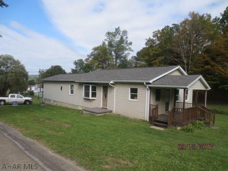 originally a manufactured home but is now permanent with the title surrendered. It has a full foundation, partial basement and has a newer addition. Beautiful remodeled home with new roof sitting on quiet .96 acres.