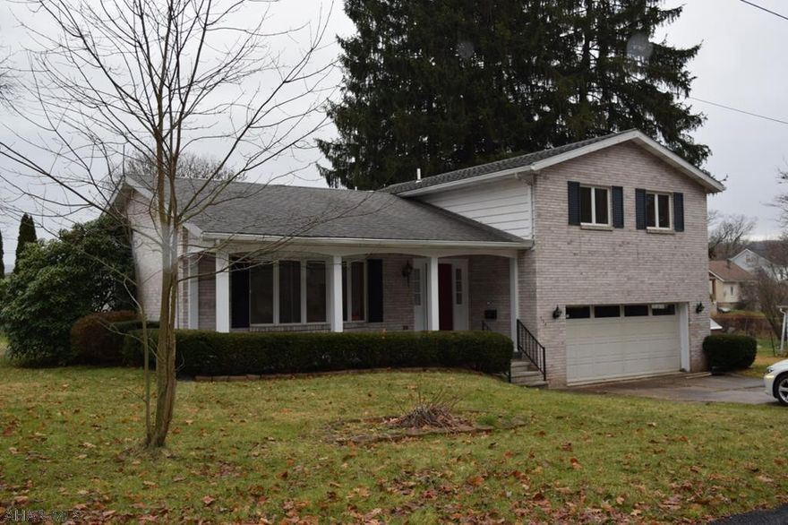 Beautiful brick accented home nestled close to the Conemaugh River on a quiet wooded street. Entertain friends and family with a backyard BBQ on the patio while the children play on the wood crafted swing set. Come inside to cool off with the central AC; then, warm up in the winter with the rustic feel of the natural wood fireplace located in the lower level den. The heated garage provides the perfect surrounding to do year round maintenance. The kitchen showcases Maytag endorsed appliances and large tile flooring. Being a block from a public park with playgrounds and minutes from historic downtown Johnstown; makes this affordable home perfect for entertaining.