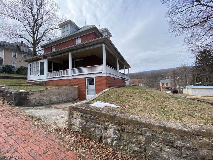 MOTIVATED SELLER! Unique find. Huge updated brick home on corner lot in Spring Cove School District on .52 acres. This home features 4  bedroom 1.5 baths, Eat in kitchen and formal dinning room. Granite countertops in kitchen ceramic tile in the kitchen and bathroom. This home offers radiant floor heating in all of the basement and bathroom. Additional updates include   refinished original hardwood flooring, molding,  insulation and dry wall, recessed lighting, ceiling fan and light fixtures, new light switches and receptacles in most of the home and  new handrailing.  This property also includes a second, flat, lot across the street with a detached 2 car garage.