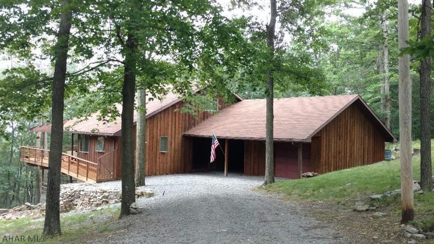 Spacious 3 bedroom home on 5.33 acres, built by an architect with large windows to maximize the flow of natural light. Beautiful views on the wrap around porch and covered patio atop Bunn Mountain are a must see. Butcher block counter tops, stainless steel appliances, wood trim, wide doorways & steps all come together in this strategically laid out floor plan. Enjoy all the amenities of living close to Raystown Lake and Trough Creek State Park. Schedule your showing today.