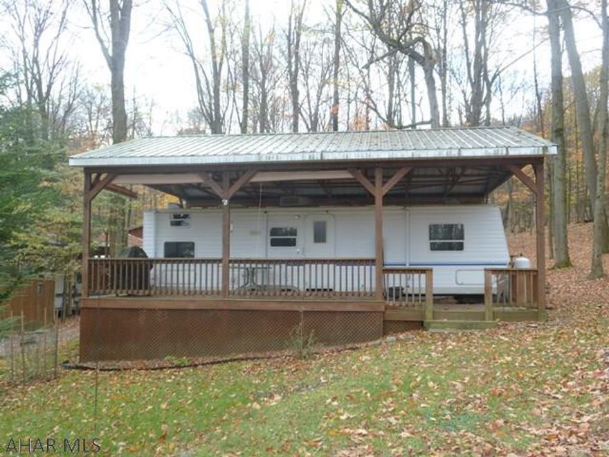 Private campsite with camper, pavilion, deck and shed.  Well maintained unit has bedroom which has a like new queen size mattress along with a bunk room for all the family. Located in Glendale Yearound a gated recreational community adjacent to Prince Gallitzin State Park / Glendale Lake / State Gamelands 108.  Six miles from Rock Run ATV Park.  City water and sewer.