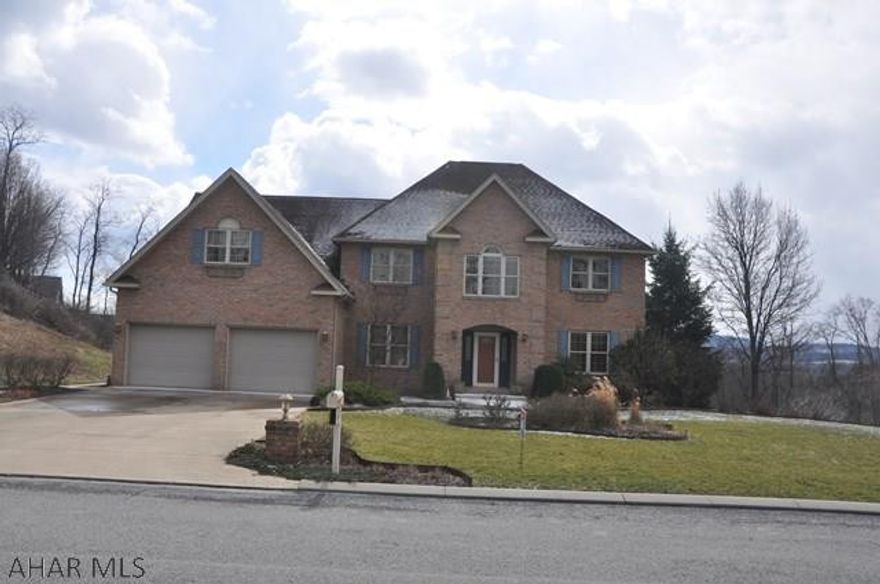 This brick colonial house is perfect for large family or someone needing an inlaw suite. Home offers large rooms, vaulted family room with stone fireplace, eat-in kitchen that is open to living space. Master suite with a sitting area or private office and master bath with a view. Also a finished daylight basement leading to professionally landscaped flat yard. A bonus room on first level could be office or in-law suite with full bath close at hand.