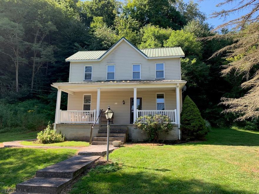 Rare find, two-story home located in the Hyndman Borough with 53.404 ACRES adjoining State Game Lands!  Very convenient location and mostly wooded land.  Home offers a living room, dining room, kitchen, 1/2 bath & laundry room combo and mud room on the main level.  Second level has four bedrooms and a full bathroom.  Covered front and side porch, oil forced air heat and wood stove, metal roof and vinyl siding.  Detached pole building used for a garage.  New survey completed on the property.