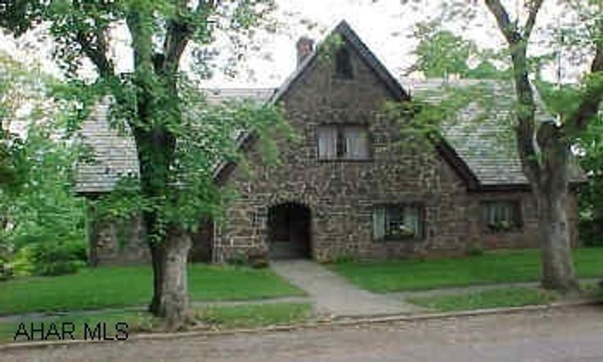Unique stone home w/ beamed style catherdral ceilings in great room. magnificent lot .45 acres beautifully landscaped 2 family rooms,hardwood floors,. Lovely & private stone patio, stone wall in the alley,off street parking. 100 amp service plus 50 amp for C/A. ONE OF A KIND PROPERTY!