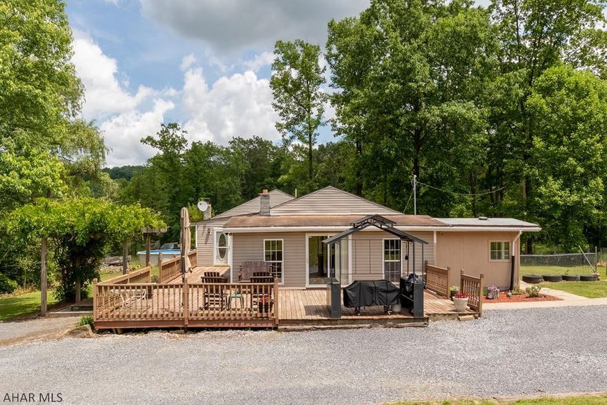 Beautiful view from your Deck looking onto farm land!  Fenced in .75 acre yard with storage shed, 2 car Metal car port (could be completed with enclosure) 3 bedrooms including a 19'8x16'8 Master Bedroom, Walkin closet, double door entrance to covered patio.  2 full baths remodeled, kitchen with eating area, 21'9x15'8 Living room and office off living room.  2 furnaces, one is an outside furnace.   NEW ROOF HAS BEEN INSTALLED 6/26/19.  NEW OIL FURNACE  INSTALLED, 2 New Windows ,  deck just painted,  See pictures and call for your showing today.