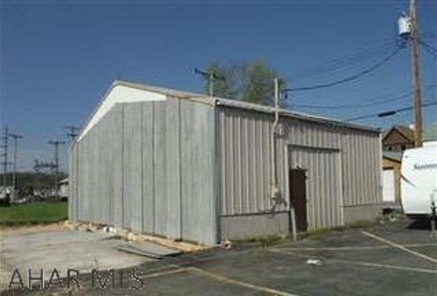 This property consists of 5 lots and also offers a 48x30 building that is currently used as a warehouse.  There is power and heat to it both currently disconnected.  Zoning is MIX residential and commercial so buyer will need to get City approval depending on desired use.