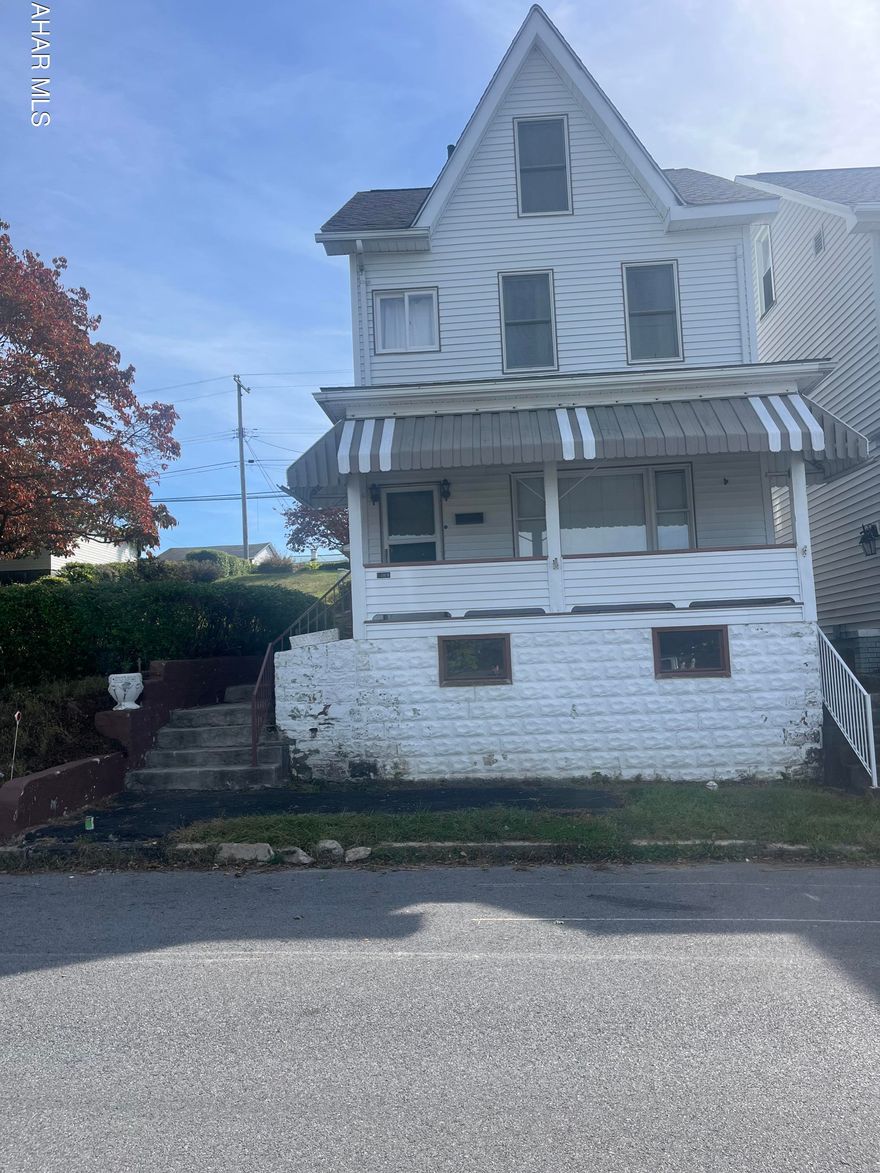 Needs some TLC. Gas hot water heat, vinyl sided, 3 BR home on double lot with 2 car garage.