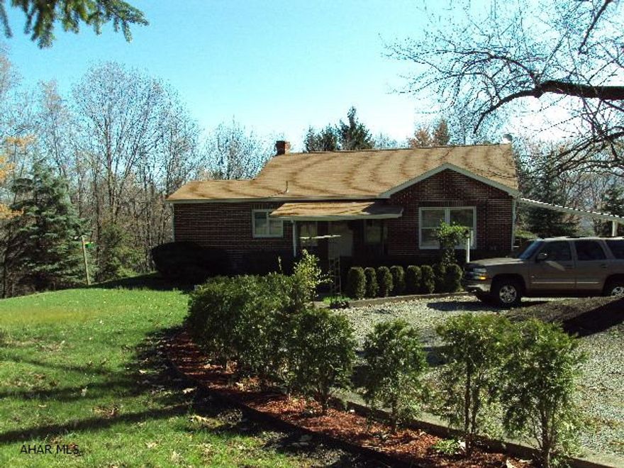 Enjoy The WildLife - Solidly Built Brick Home - Hardwood Floors Under Carpet - 2 Bedrooms, 1 1/2 Baths - Also 2 Finished Rooms In Bsmt. One Used As Bedroom, One As Gameroom - Stone F.P. In L.R. - Eat In Kitchen - All On 2.38 Acres In Logan Twsp.