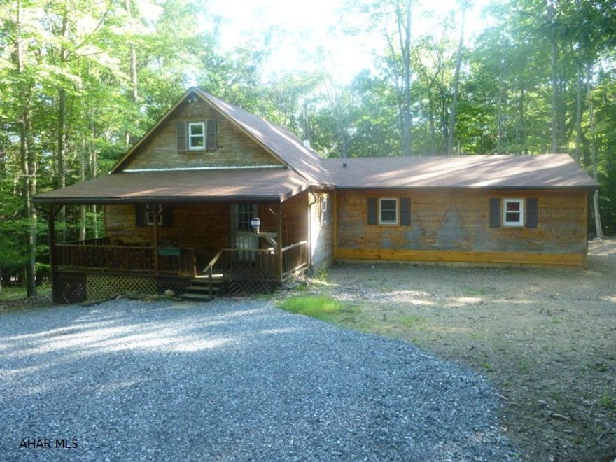 Looking for that hidden gem with a bargain price?  Here it is - a three bedroom cabin that has been completely remodeled inside except for the flooring.  The owner is leaving that for the new inhabitants to choose.  Two bedrooms are on the main floor; climb the spiral staircase to the third located in the loft.  Look down on the living room warmed on cold evenings by the wood stove.  A bonus room that could serve as a den or family room and a laundry room along with two bathrooms round out the living spaces.  Sit out on the screened in covered deck out back to experience the peaceful surroundings and the wildlife.   The exterior of the home will be finished by the owner.  The selling price includes the cost of finishing the outside of the cabin.