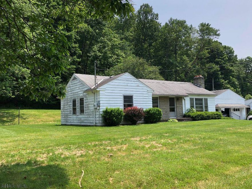 Three bedroom, one bath ranch home in a nice location. Stone fireplace in living room. Two car garage. House needs TLC. Being sold AS-IS.