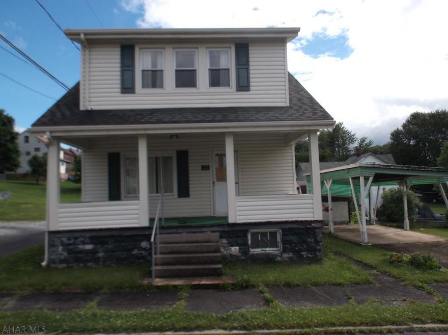 Great location for this home that needs your TLC.  Spacious living room, formal dining room.  Carport, open front porch for relaxing evenings.  Windows were updated to thermo-pane.  Vinyl siding is newer.  Any measurements based on courthouse records - Buyer to confirm.   AS-IS SALE