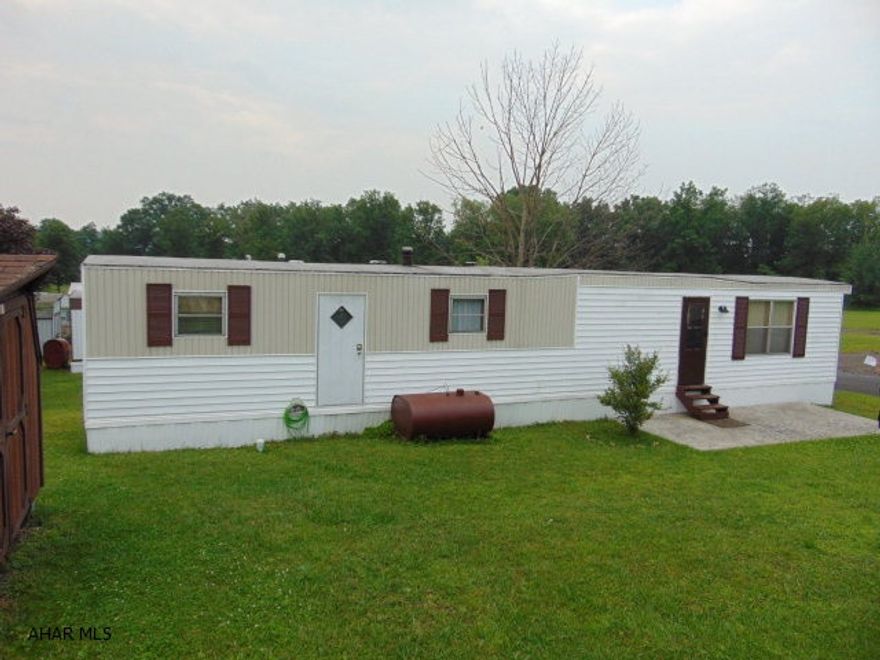 Perfect place to downsize or get a fresh start!  2 Bedroom, one bath single-wide in a quiet location.  Central air, vinyl siding,shed with electric, all appliances and furniture are included!  Bring your clothes and move right in!