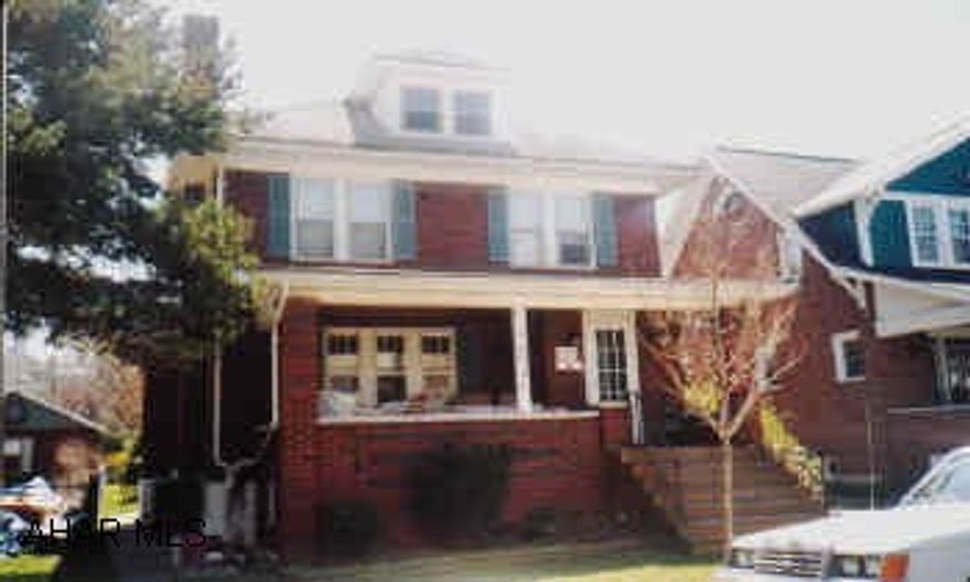 2 1/2 Story brick. Side entrance to basement, ceiling fan in living room, and 2 bedrooms.