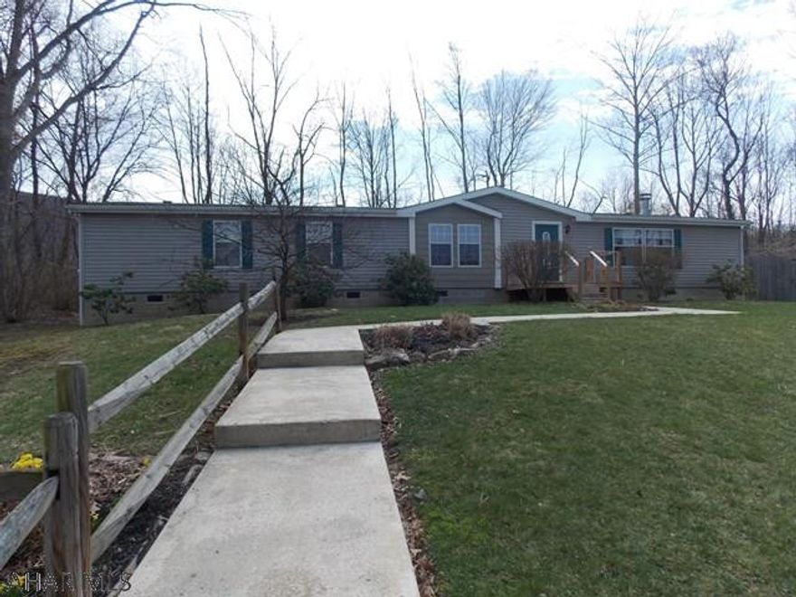 WOW! This home is huge with wide open space for entertaining. Lovely stone fireplace and surround sound to relax and watch movies or sports with the family. There is also an additional living room when entertaining large groups. Unbelievable master suite is sure to please with sitting area to read  or watch TV and double doors leading to the luxurious bath. The other 2 bedrooms share another large bath with double sinks. Great outdoor space and privacy on the large lot with 2 decks one is 16x16 the other is 12x12.  Many of the trees and shrubs will be flowering soon and show lots of beautiful color.  Home also has 2 sheds for storage. 2017 taxes are estimated.