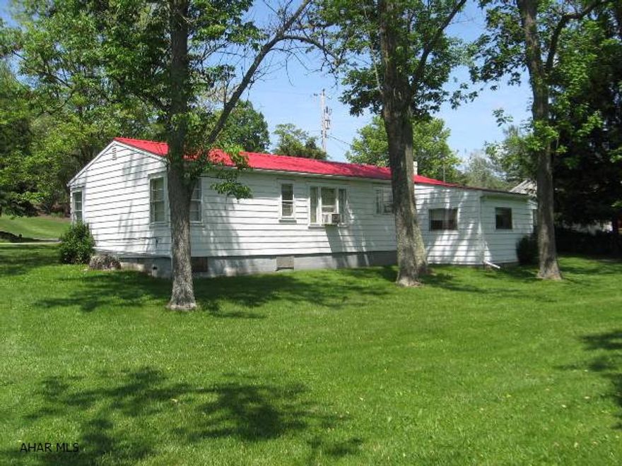 A good investment or live in one and rent the other.  This multi-unit property features a spacious cottage with extras like a family room, workshop, garage and a quaint bridge crossing between large yards to the second home a 3 bedroom, 1.5 bath trailer with lots of character and large porch to enjoy entertaining or lazy summer afternoons.