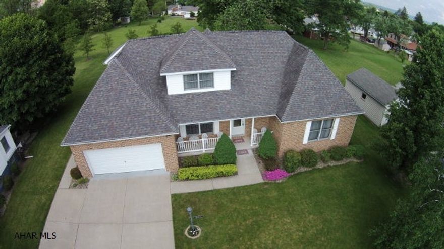 Reduced - Don't miss your chance - LOW TAXES under $2,000 per year.  Luxury living with 4 bedrooms, lots of bathrooms and a fantastic floor plan. This home is in like new condition - built in 2000.  Large open living room with vaulted ceiling, 2 story home with walkthrough and 2 (3/4) bathrooms!  Situated on a large lot with low taxes.  Double insulated for energy savings and upscale amenities like oak doors and trim throughout, tray ceilings and built ins.  Large sunroom to relax and an expanded floor plan on the 2nd floor to add a bonus room.  Loads of storage and walk in closet space.  Partial finished basement.  Note the original plans attached don't show the additional room or the sunroom.  The house also features a whole house generator - never be without power!