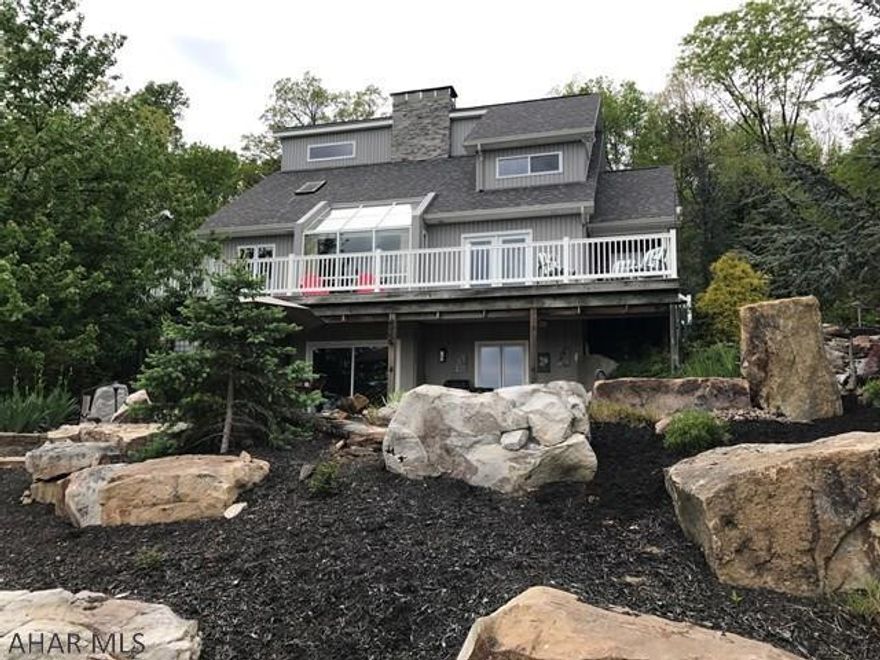 If you are looking for a secluded upscale home in the Alleghany mountains with breathtaking views from every room, this 3 bedrooms, 3 bath home will definitely not disappoint. Guest and family will be greeted by the sounds of nature with gorgeous waterfall pond that give way to some of the most magnificent views in the county. Quality workmanship inside and out is evident from the professional landscaping, custom designed home to the two-car garage and beyond. The walk out lower level will impress even the most discriminating buyer with it custom made features. So many activities can thrive in this amazing property from fishing on the Juniata River which borders the property to hunting and hiking throughout the gorgeous countryside.