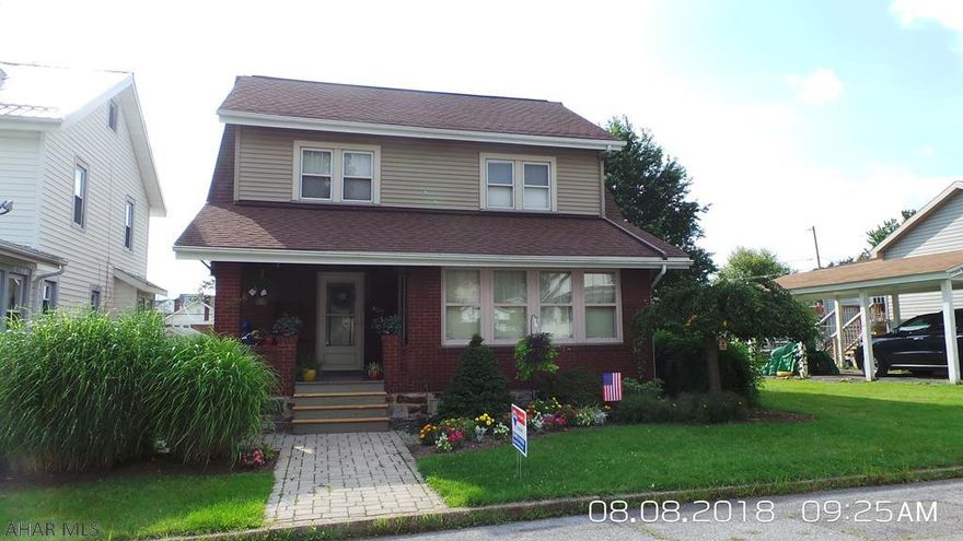 Cute & roomy brick home with off street parking, updated kitchen with counter seating and newer vinyl plank flooring.  DR with hardwood floors.  LR fireplace has a gas hook-up.