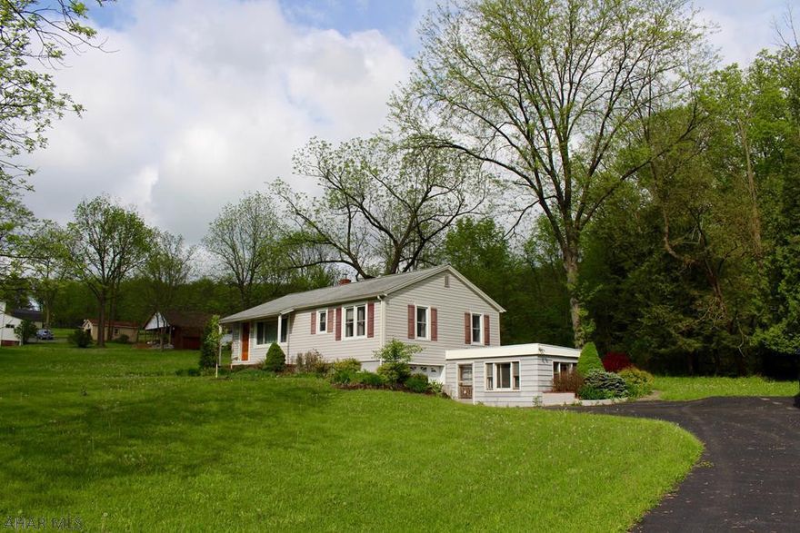 Raised ranch home in the Hollidaysburg Area School District!  This home has 3 bedrooms and 1 full bath situated on a large (approx 1.6 acre) lot.  Hardwood floors throughout (some covered by carpet), covered back porch, newer furnace, and 1 car garage just to name a few more of the features of this great home! Plot lines in photo are approx.