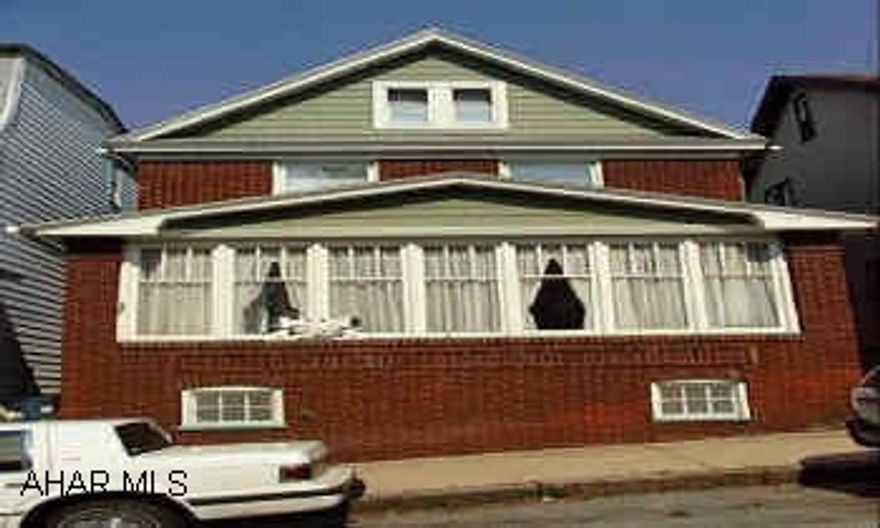 Very nice Brick home in need of some cosmetic work but has new windows & roof.  Lots of Potential Must See