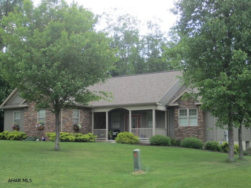 Gorgeous custom built home in Rolling Hills North.   Spectacular inside and out.   Inside has a unique open floor plan.  Kitchen cabinets are custom design  iMaster Bedroom suite.  Many special touches added to make this home a one of a kind.  Enjoy the tranquil outdoors on a spacious deck upstairs or patio downstairs. The property is at the end of the road surrounded by woods and beautifully landscaped.  Please check out this property.  This home was designed and built by a private builder.