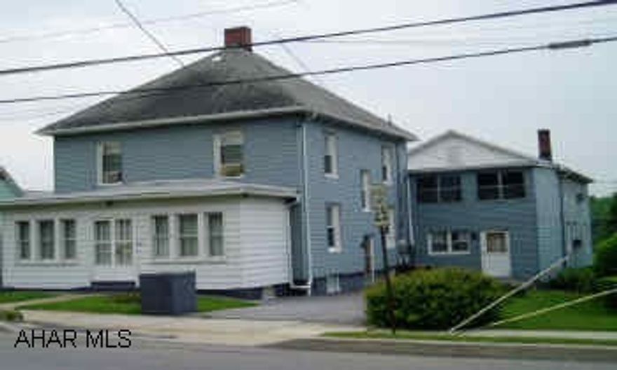 Well maintained 2-story, 3BR/2.5BA Block/Vinyl siding house with like style Duplex w/low maintence, fuel efficient buildings. 1000 sq. ft. daylight basement, garage with paved parking area that formerly contained a small business. Coin operated laundry in duplex for tenants.