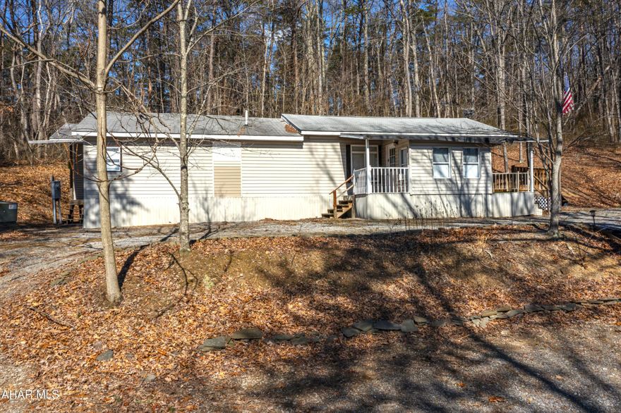 Discover the perfect private getaway or future home with this 2 bedroom, 1-bath manufactured home set on 9.07 acres of mostly wooded land. The property offers a serene mountainside location, ideal for those seeking peace and privacy. With thoughtful additions including a 3rd  large captive bedroom, the home provides ample room for relaxation and enjoyment. A large shed is also included, perfect for storing tools or motorized vehicles. Whether you're looking for a hunting camp cabin, a weekend retreat, or a single-family home, this property has endless potential. Enjoy the natural surroundings from the spacious deck, or explore the wooded acres at your leisure. Cash only