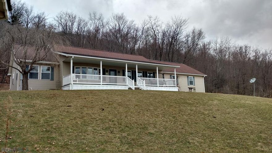 Million-dollar view on over 3 acres! This 1 story, handicapped accessible home was built in 2000 and has an open floor plan. Features include: central air, vaulted ceilings, skylights, master bathroom with jetted tub and walk-in closet, large garage with extra storage, back up generator, covered front porch, back patio, gazebo, shed, motion lights, and last, but not least, privacy!