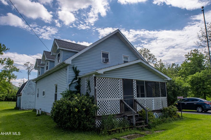 This quaint one and a half story home sits on a level lot and features an inviting enclosed porch. Inside, the main floor offers an eat-in kitchen and convenient laundry. Upstairs, you'll find three bedrooms and a full bath. It's a comfortable and practical home.