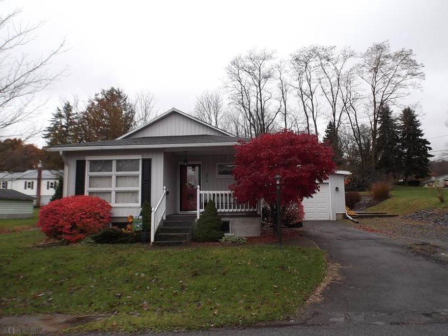 ..OPEN HOUSE, Sunday 2/10  (1:30 - 3:00)  Simply adorable AND cute and move in ready!!.......move out of the hustle and bustle of city living, but....only a FEW minutes "from it all" for modern conveniences.  Features a large eat-in kitchen with Ceramic tile floor.   The living room is quite spacious as well.  No need to worry about "updating" the bathroom -- it's ALREADY done for you.  This great home is truly a MUST SEE, so don't just do a drive by or it will be your loss.    It's one of those homes that just "feels like home" from the moment you walk inside:)    It has a 1 car attached garage so you don't need to worry about the RAIN.  The basement has a nice recreation room, for the kids or football games w/your buddies.  Situated on a nice corner lot - almost 1/2 acre!!  ONLY $130,000