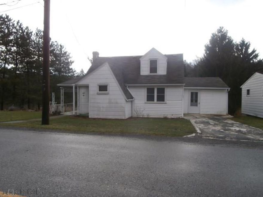 1.5 story home in a nice location at the outskirts of town. Large rear yard. Estate type home thats been in this family for a long period of time. Eat in kitchen, knotty pine dining room, large living room. Modern bath. Call office for details.