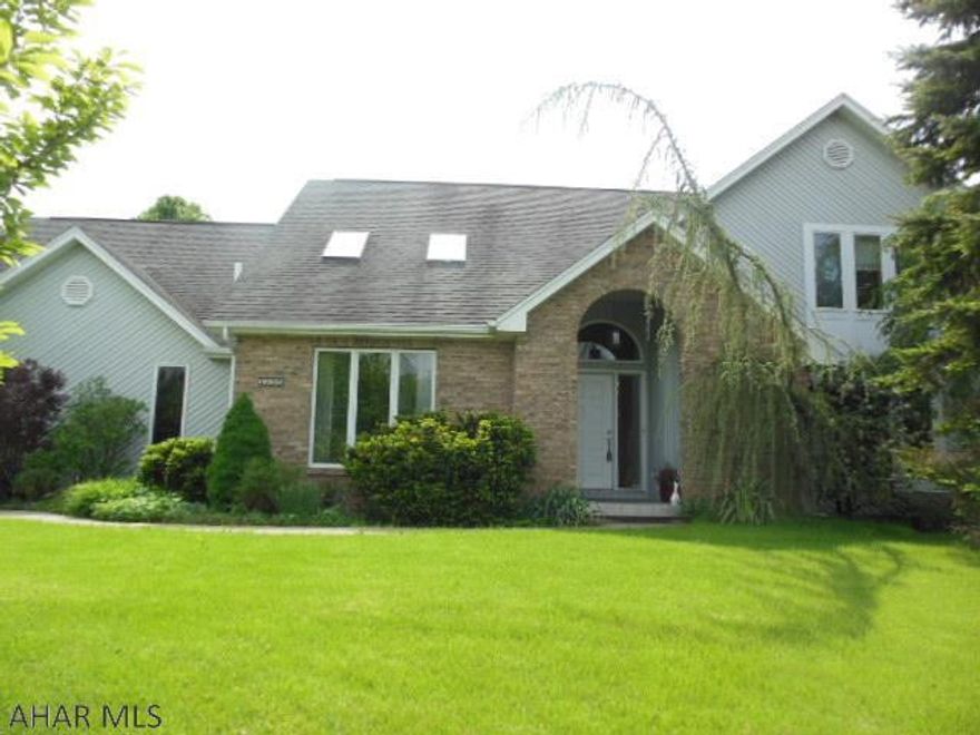 Upscale & Well maintained Contemporary Home with many upgrades such as: Gourmet Range w/ Vented Range Hood, Double-Oven, Oak Kitchen Cabinets with Island and Dining Area, Wine Cellar Room with Cabinet, new flooring in places, ample closet space, HE Gas furnace w/CA, rear Covered Deck w/Ceiling fan, Beautiful, Mature landscaping w/ Raised-Bed Garden, over-sized garage w/insulated door, auto opener and so much more! Must see the more!