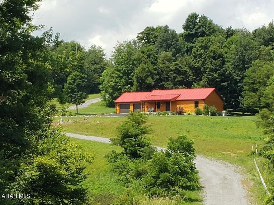 2-bedroom 2-bath log home with tongue & groove pine vaulted ceiling, open floor plan, kitchen with island counter built in 2020 & tremendous view of mountains on 1.78 Acres. Vinyl interlocking plank flooring throughout. Full basement with Superior walls - finish for additional living area. J-624